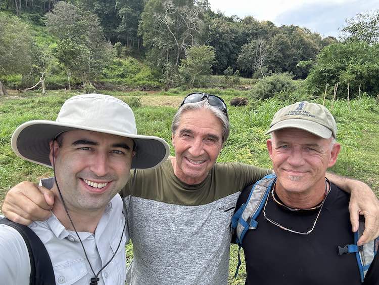 Three American expats hangout together in Chiang Mai, Thailand at the Elephant sanctuary.