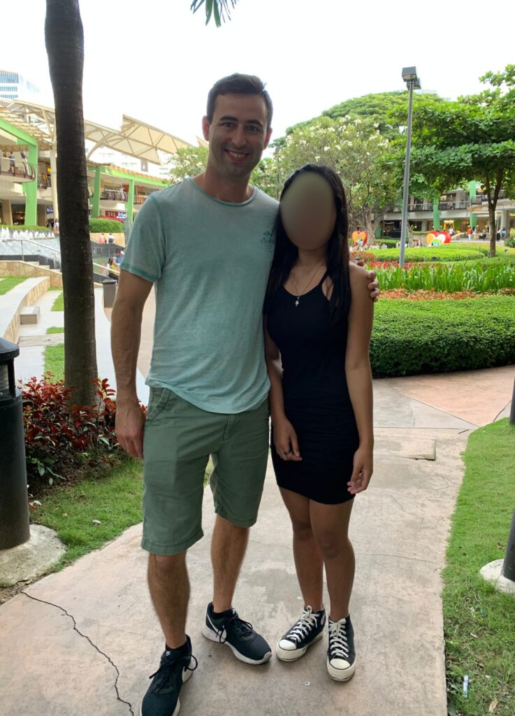 American man with Filipina girlfriend in Ayala mall in Cebu City, Philippines, using daygame PUA strategies.