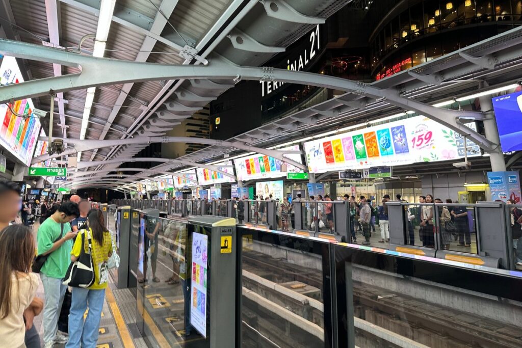 Image of the subway metro train line in Bangkok, Thailand at the Asok stop with Terminal 21 shopping mall in the background.