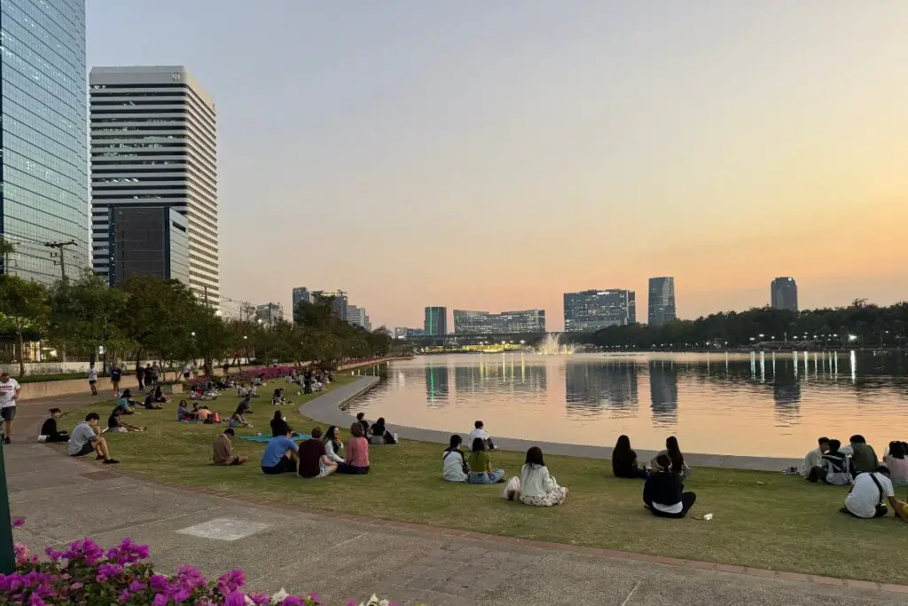 Benchakitti Forest Park in downtown Bangkok near Terminal 21 at sunset, with lots of gorgeous Thai women walking.