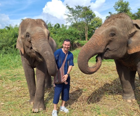 Me (Eric James) feeding the elephants at an elephant sanctuary in Chiang Mai, Thailand.