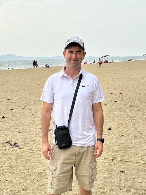 Foreigner standing on Pattaya Beach.