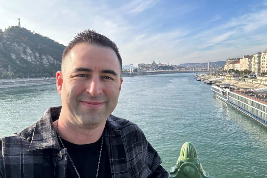 Eric James (me) hanging out in Budapest Hungary near the river.