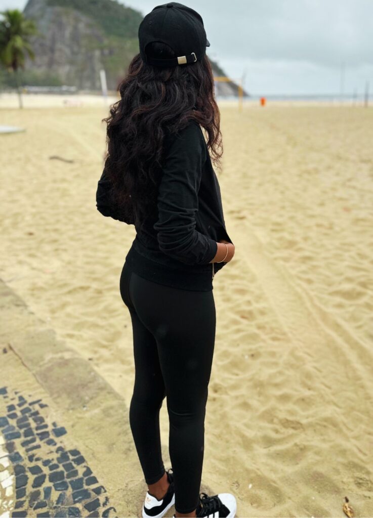 Hot Brazilian women standing on Copacabana beach in Rio de Janeiro during the cold season.