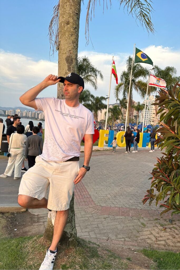 Eric James in Florianopolis, Brazil standing near the pier.