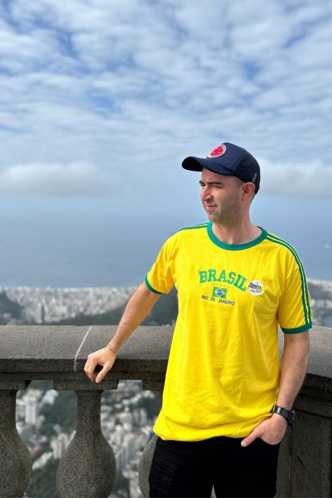 Eric James chilling from with the view at the Christ the redeemer statue.