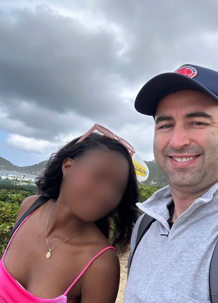 American man with Brazilian girlfriend on a Florianopolis beach.