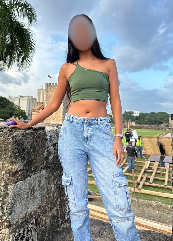 Sexy Dominican woman standing in Zona Colonial, Santo Domingo, Dominican Republic.