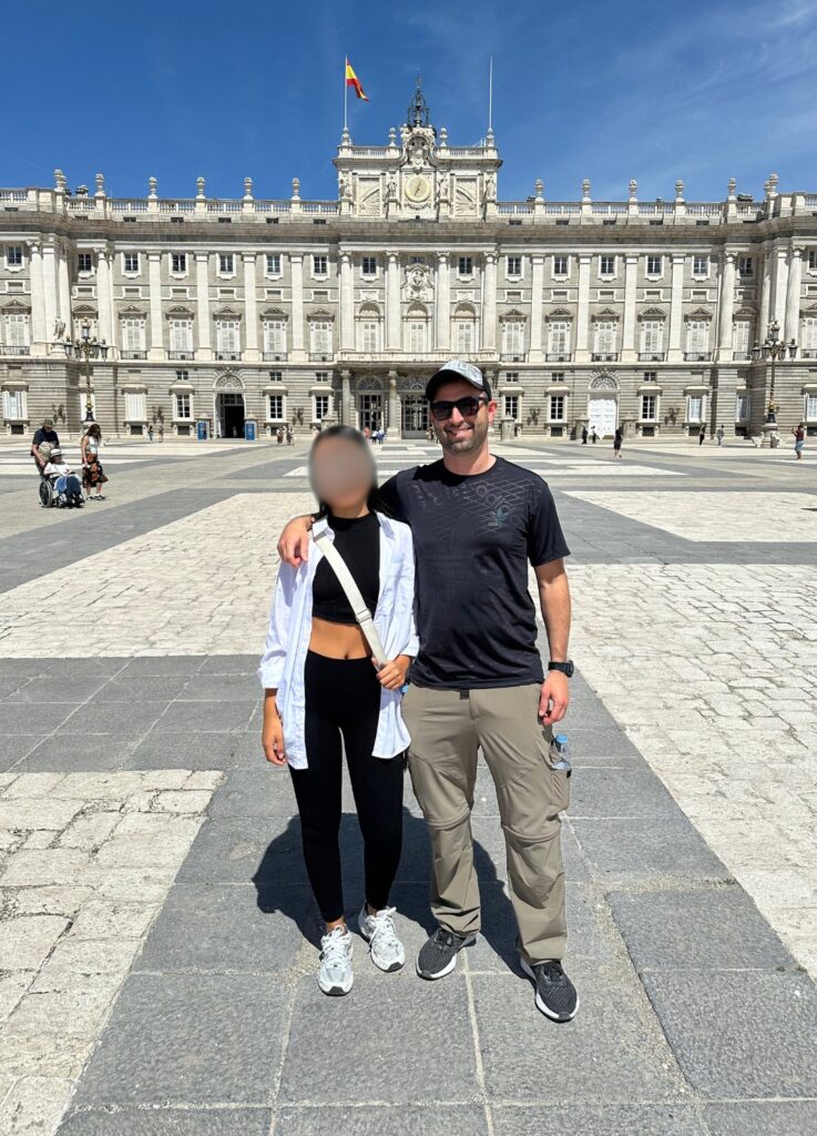 Hot Spanish woman with American boyfriend at Royal Palace in Madrid, Spain.